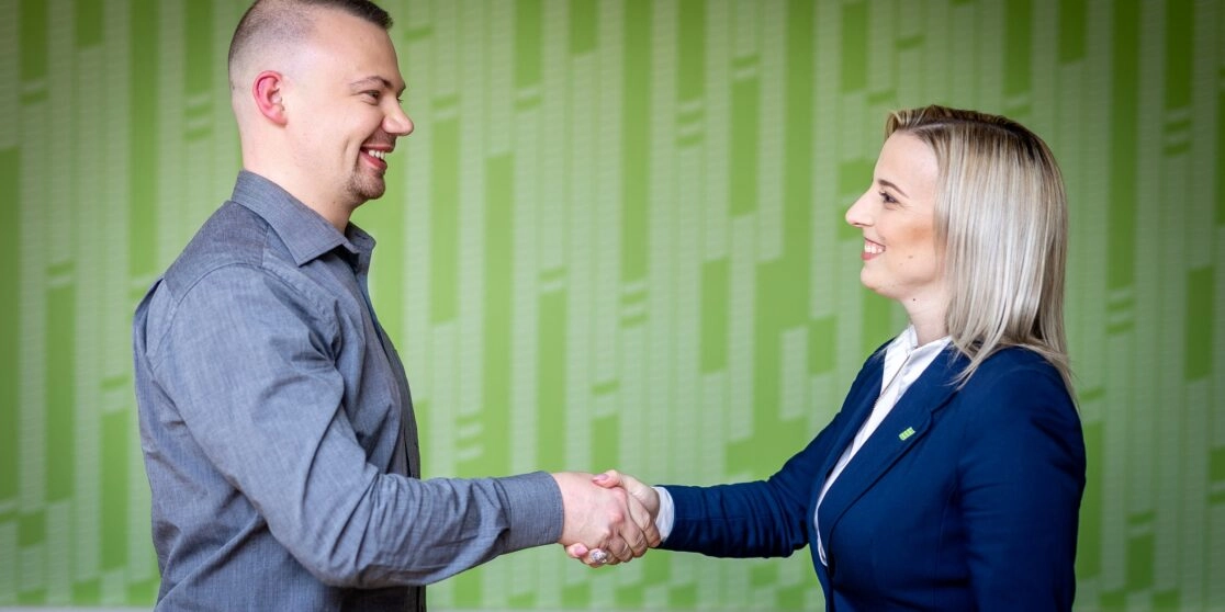 Hand shaking between a TRIGO manager and a customer
