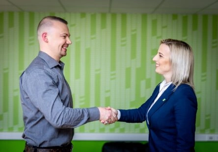 Hand shaking between a TRIGO manager and a customer