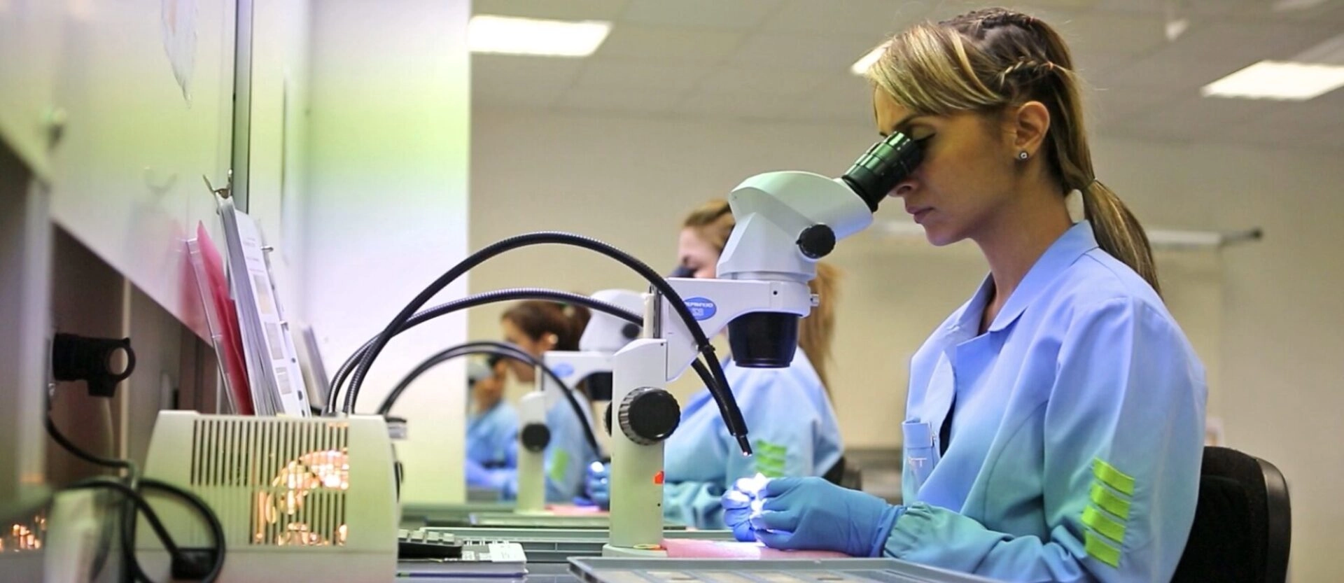 TRIGO Quality Expert Inspecting a Part Using a Microscope Device