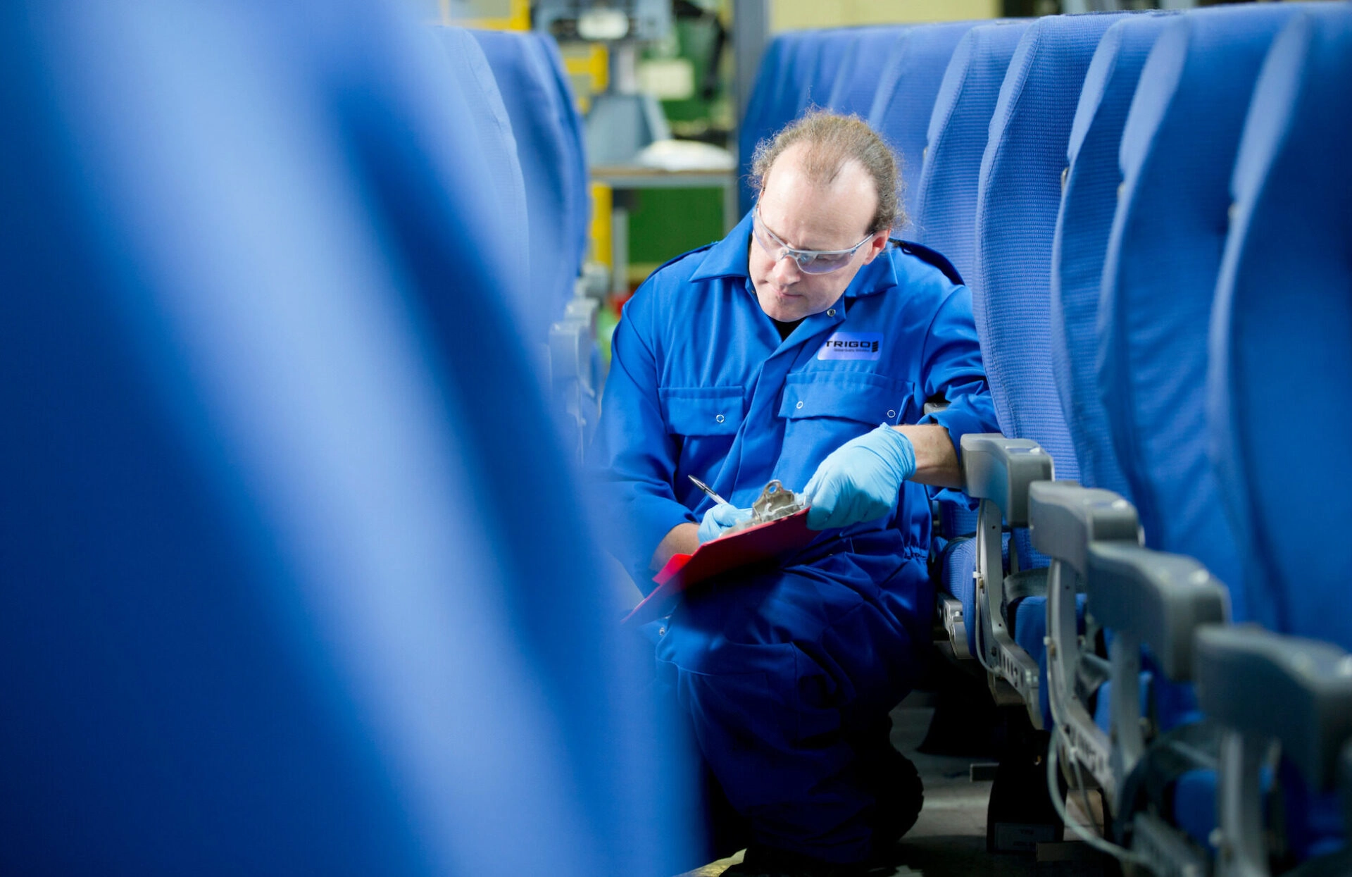 A TRIGO Quality manager inspecting an aircraft cabin. All rights reserved.