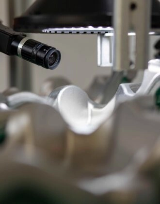 Spark, our automated optical inspection system inspecting a metal part.