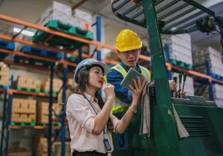 Malaysian Quality engine er and Quality Manager checking data on a tablet