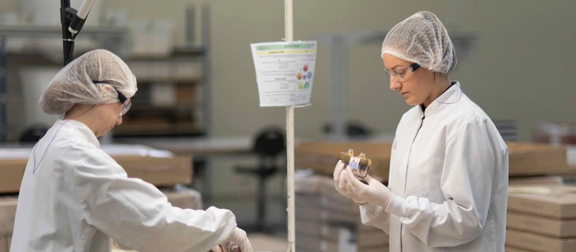 Two TRIGO Quality experts checking a parfume bottles