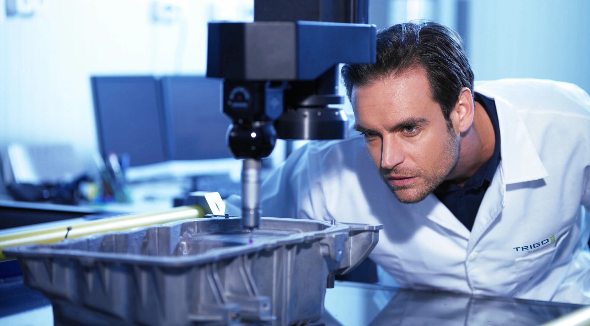 A TRIGO Quality Inspector using a 3D metrology device to inspect a manufacturing component